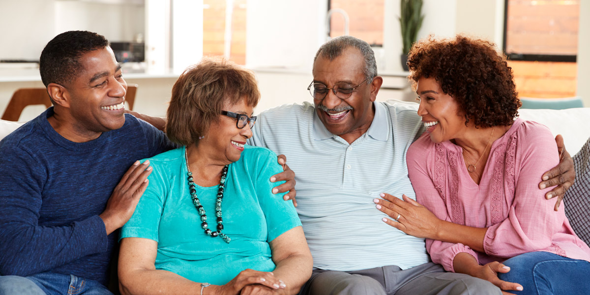 Family on Couch Laughing