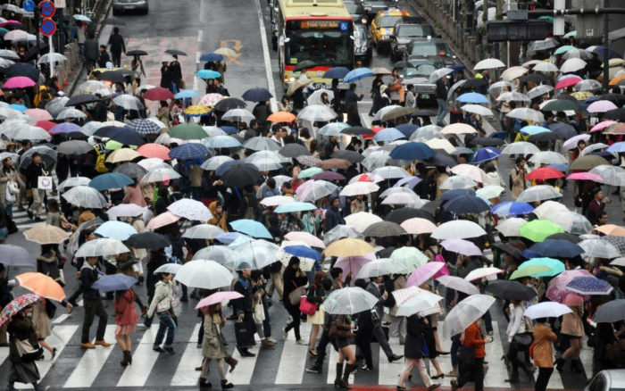 People in Rain Storm